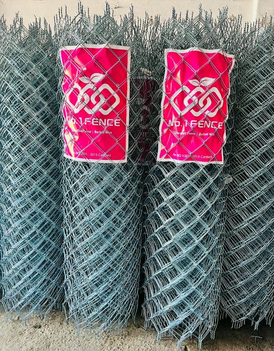 Galvanized chain link fence rolls stacked at the No.1 Fence factory, ISO 9001:2015 certified